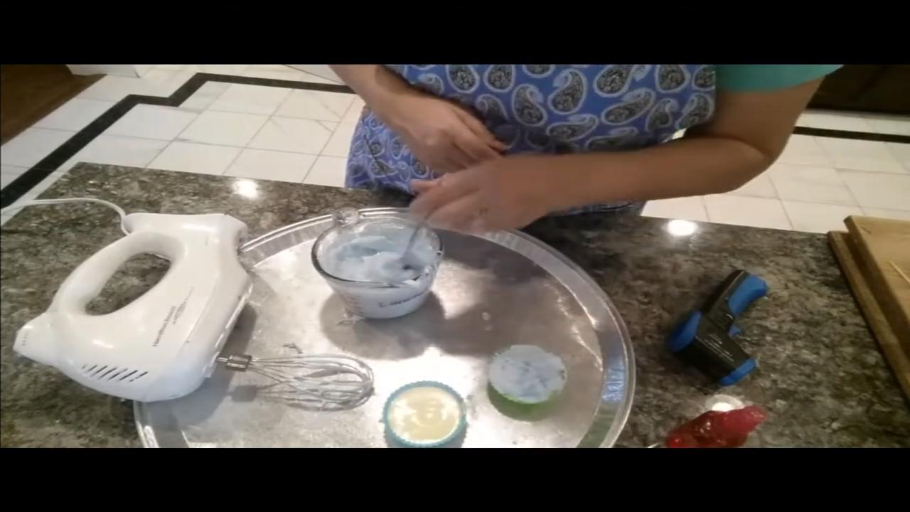 Pressing a small rubber duck into the whipped soap waves