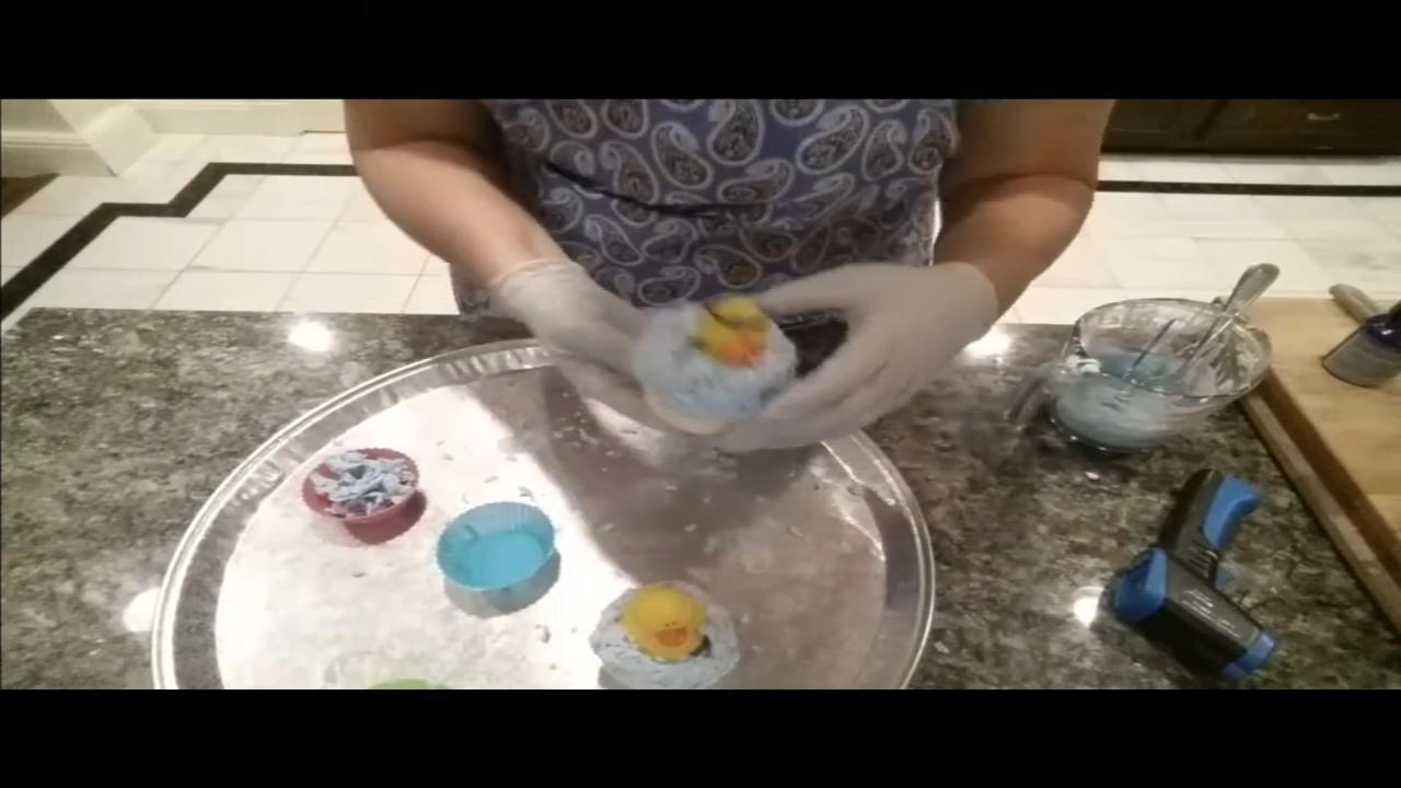Finished rubber duck cupcake soaps with aqua whipped soap waves