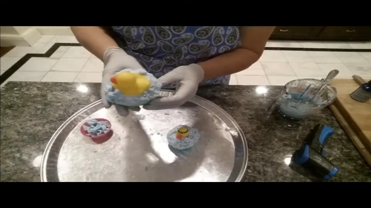 Peeling the silicone cup off a rubber duck cupcake soap