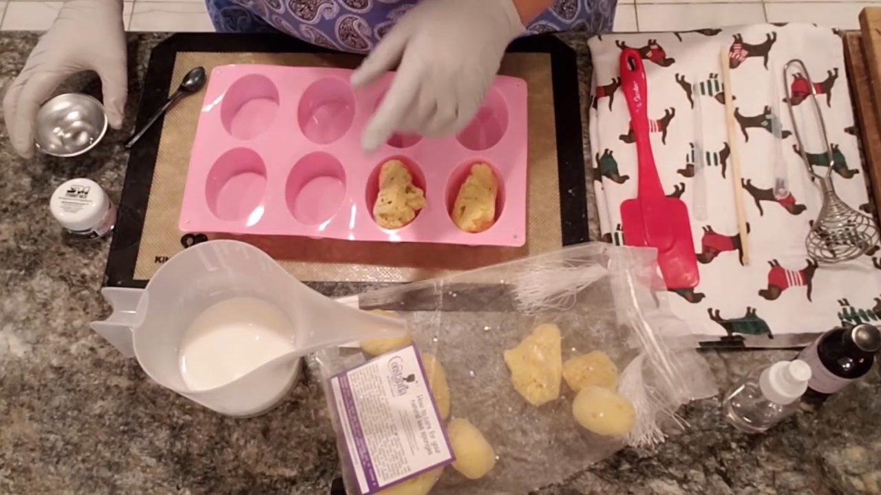 Melted shea butter melt and pour soap next to sea sponges in the mold