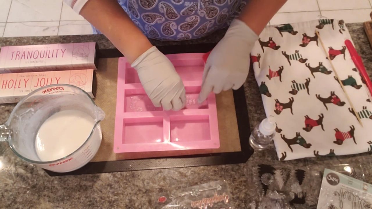 Melted white goats milk soap ready to pour over the stamps