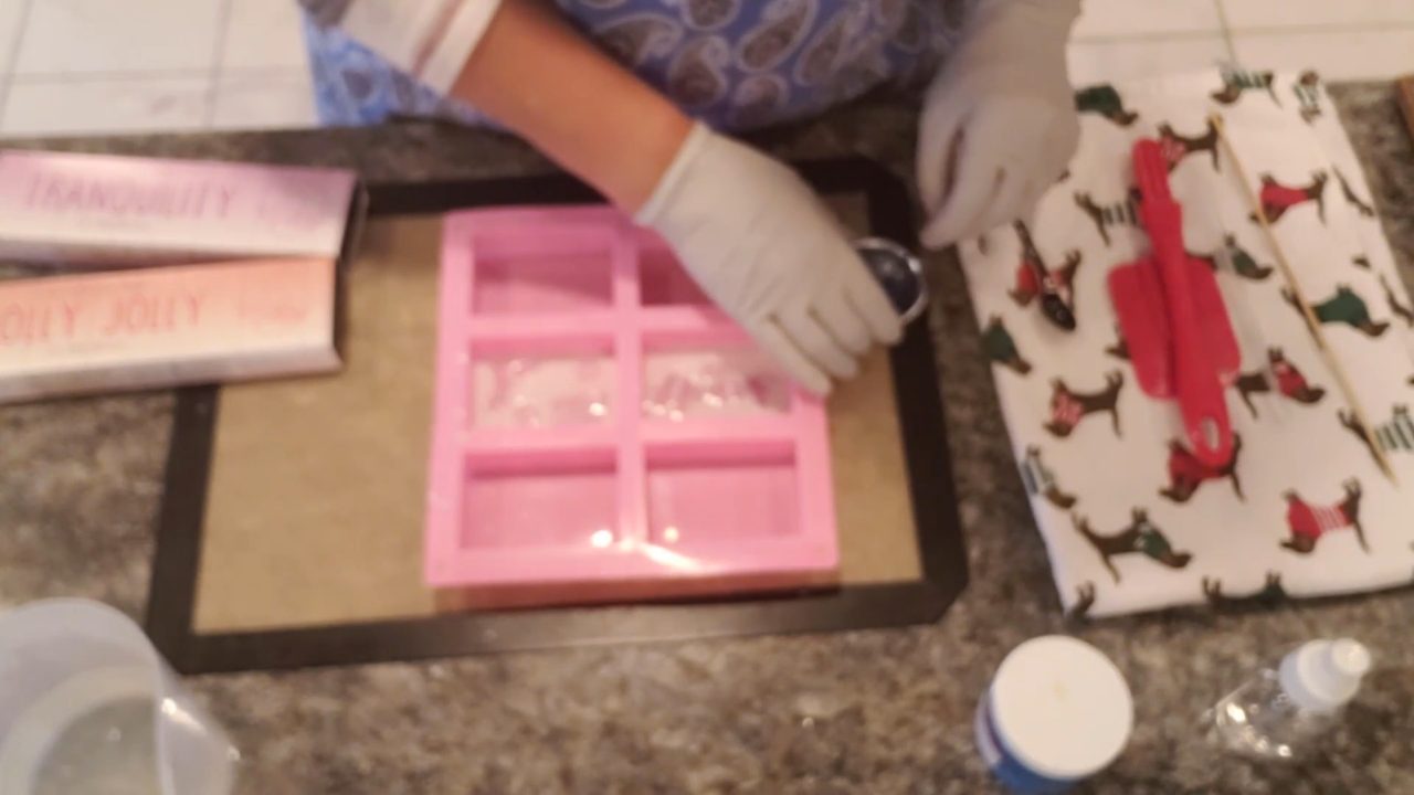 Mixing blue mica into clear melt and pour soap