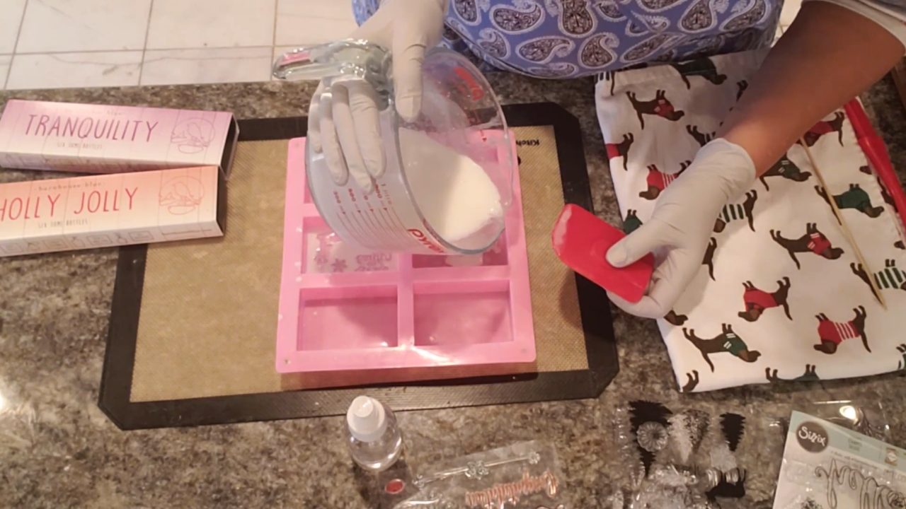 Thin white soap layer over the stamps in the mold