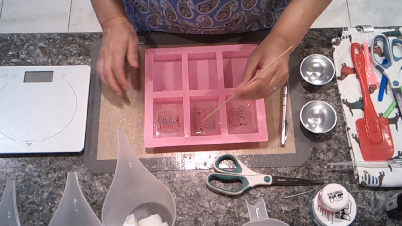 Pictures set in clear soap with a little bio glitter around the edges