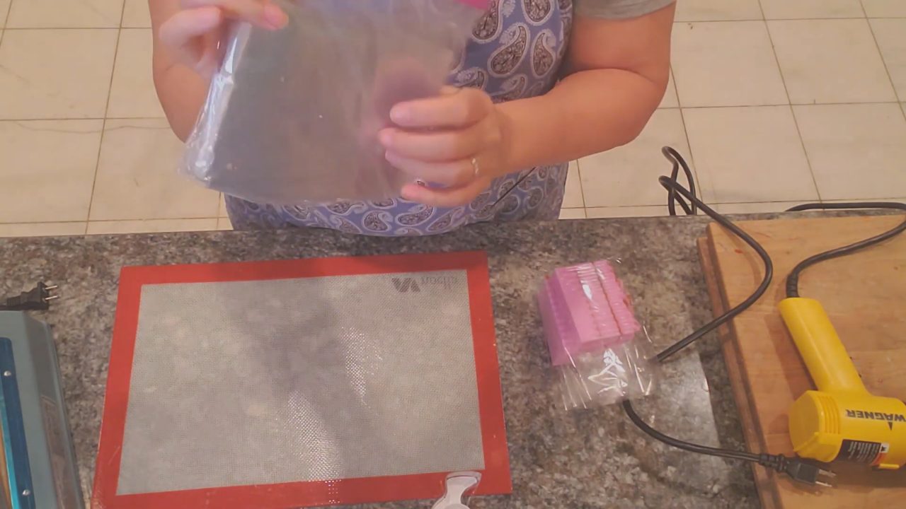 Putting a melt and pour soap bar into a shrink wrap bag