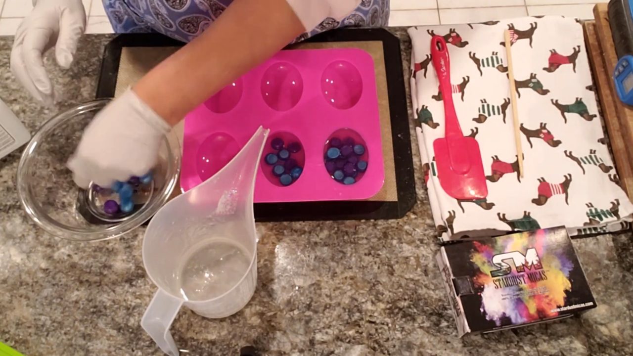 Covering the ball embeds with more clear melt and pour soap
