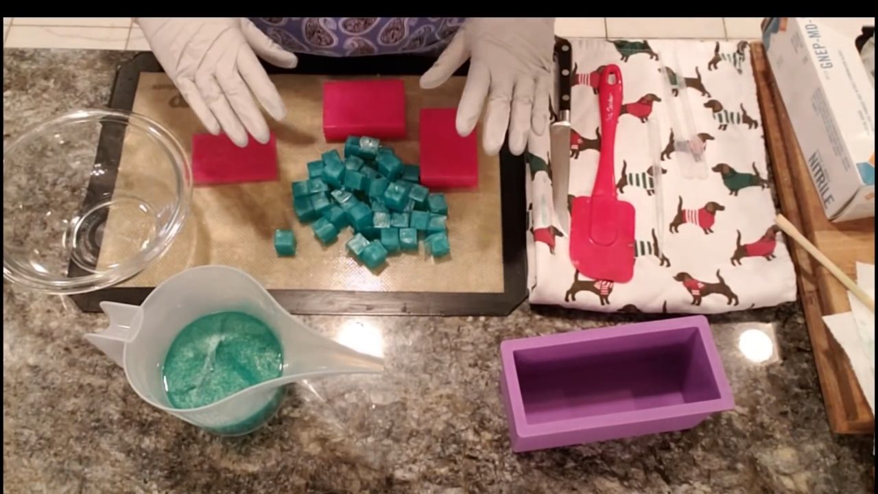 Cutting red and green soap squares into diagonal gemstone embeds