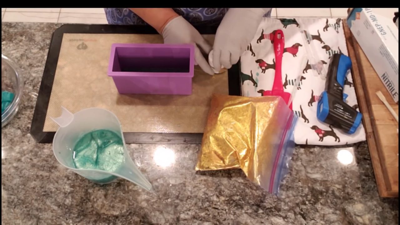 Gold mica coated red and green soap embeds ready for the mold