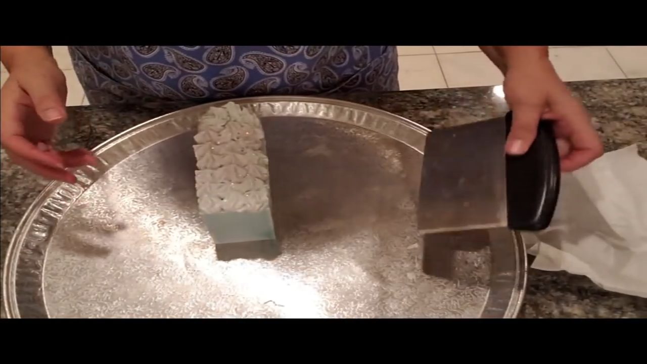 Cutting the Summertime Elegance melt and pour soap loaf into bars