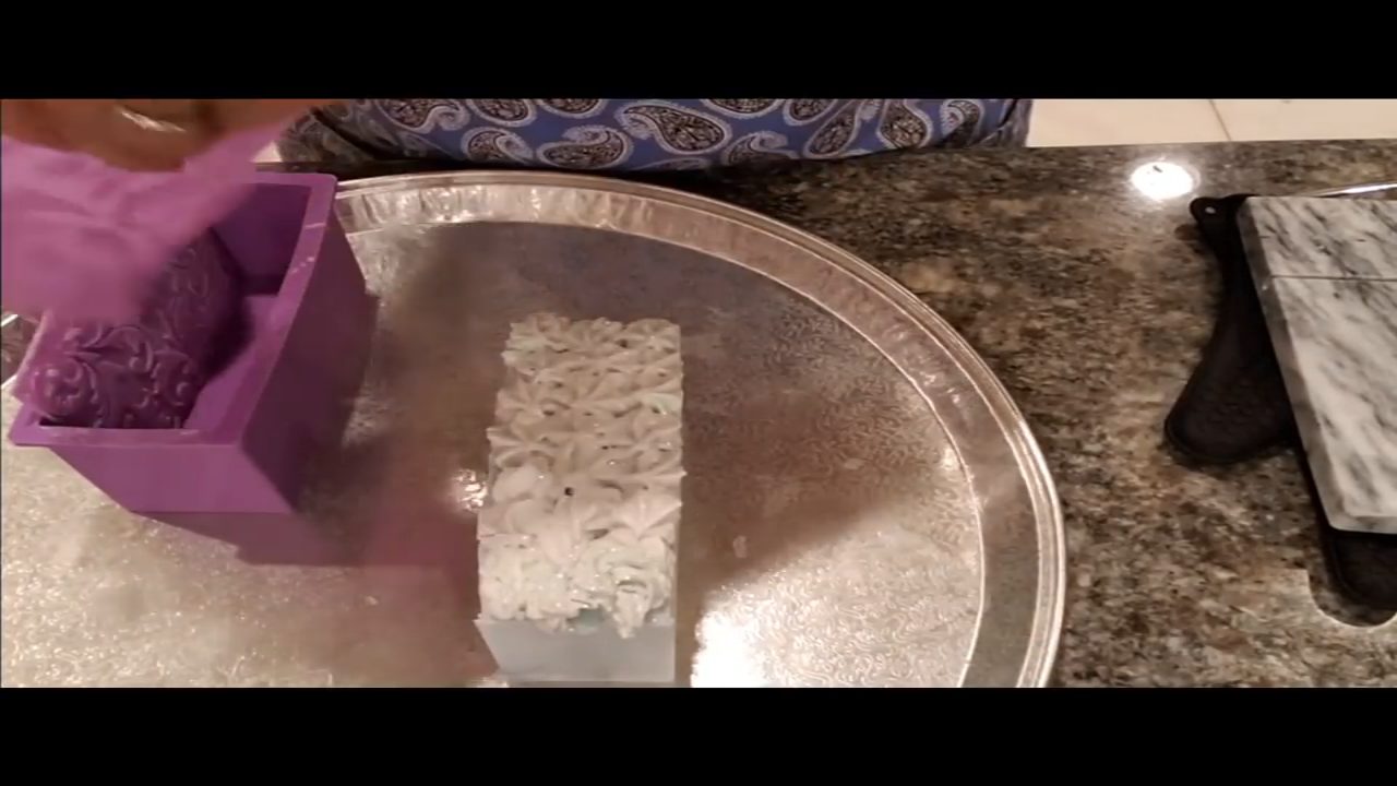 Unmolded Summertime Elegance soap loaf with an impression mat design on the side