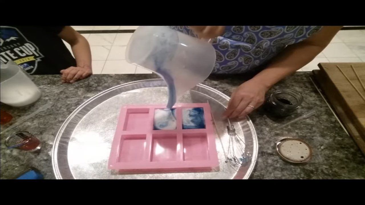 Pouring swirled melt and pour soap into a 6 cavity bar mold