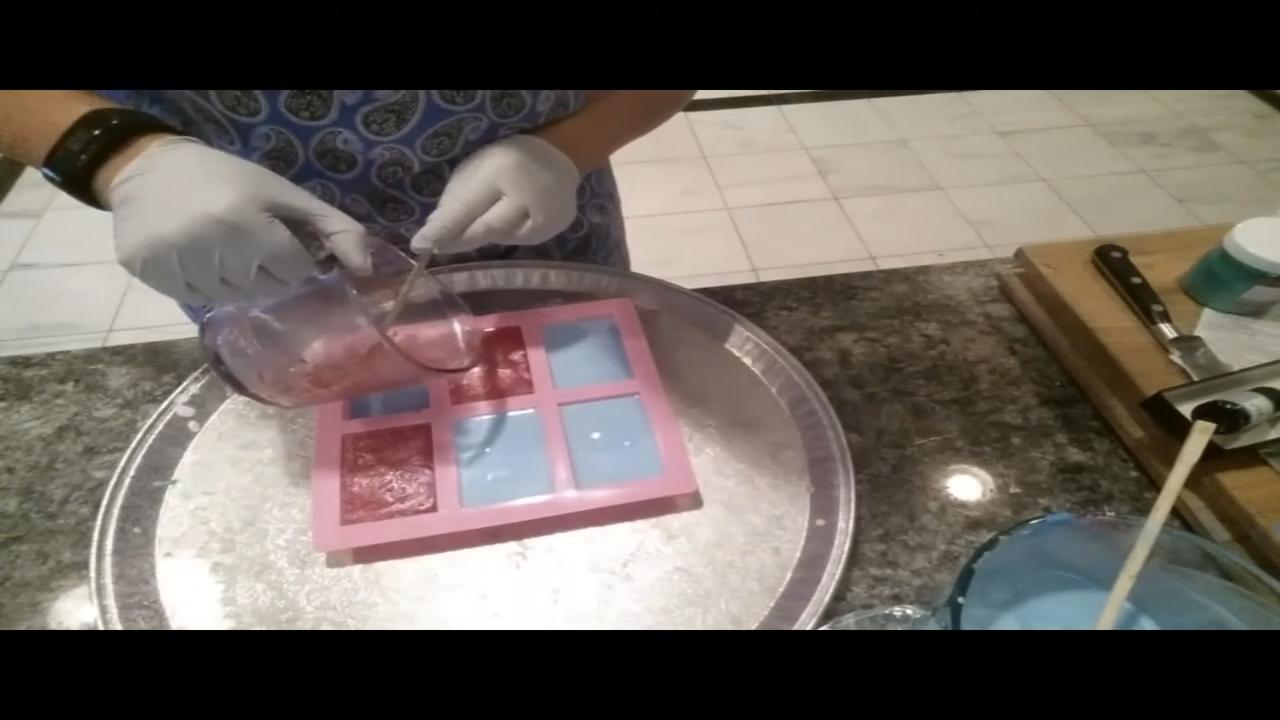 Pouring pink soap into the mold