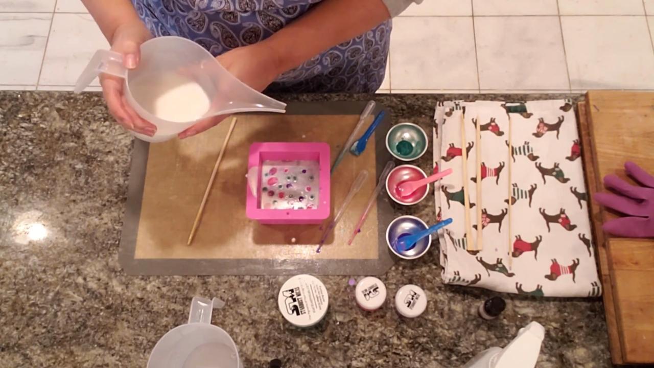 Pouring the second layer of shea butter soap