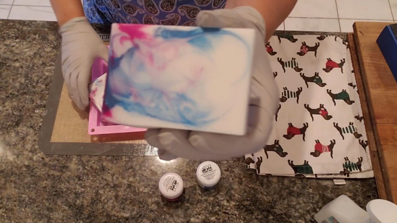 Pink and blue tie dye melt and pour soap bar showing the swirl
