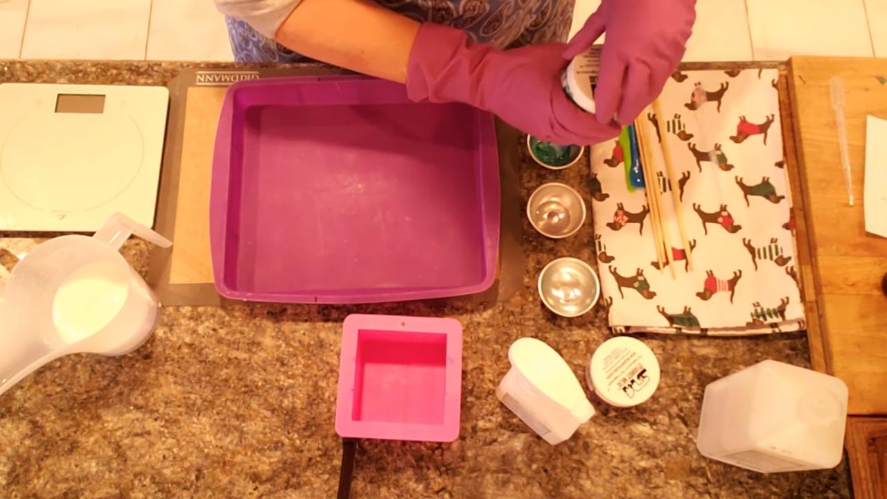 Mixing purple mica into melted shea butter soap