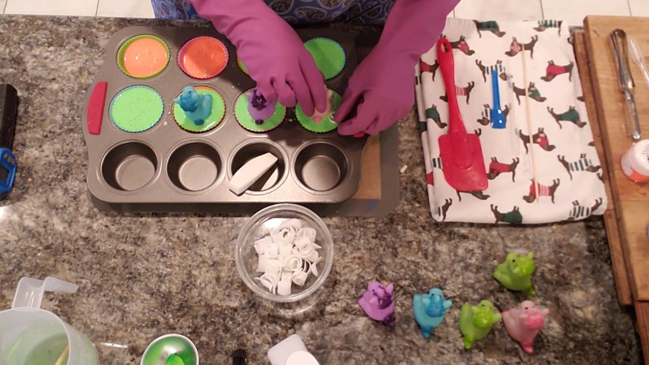 Adding unicorn figures and soap curls on top of the cupcake soaps