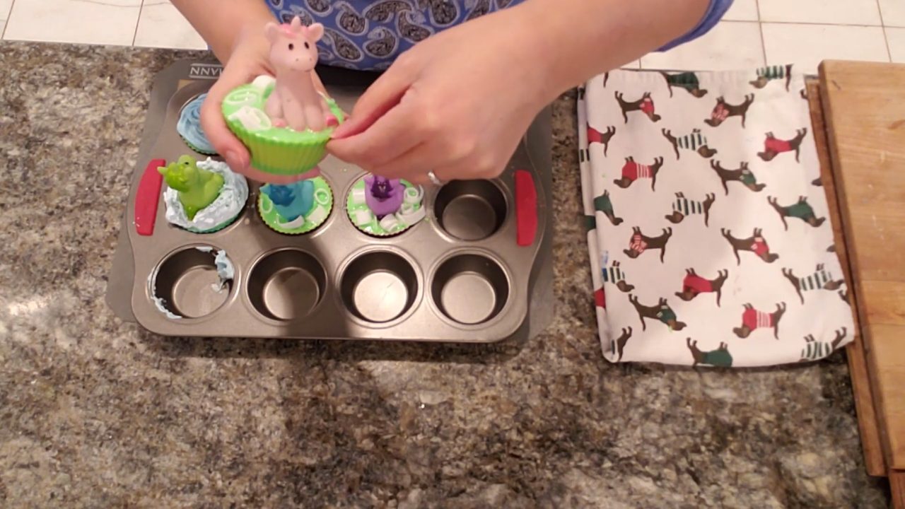 Peeling the silicone liner off a neon unicorn cupcake soap