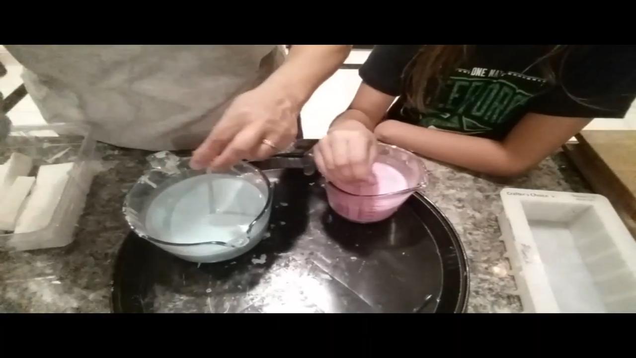 Melted pastel green and pink goat milk soap