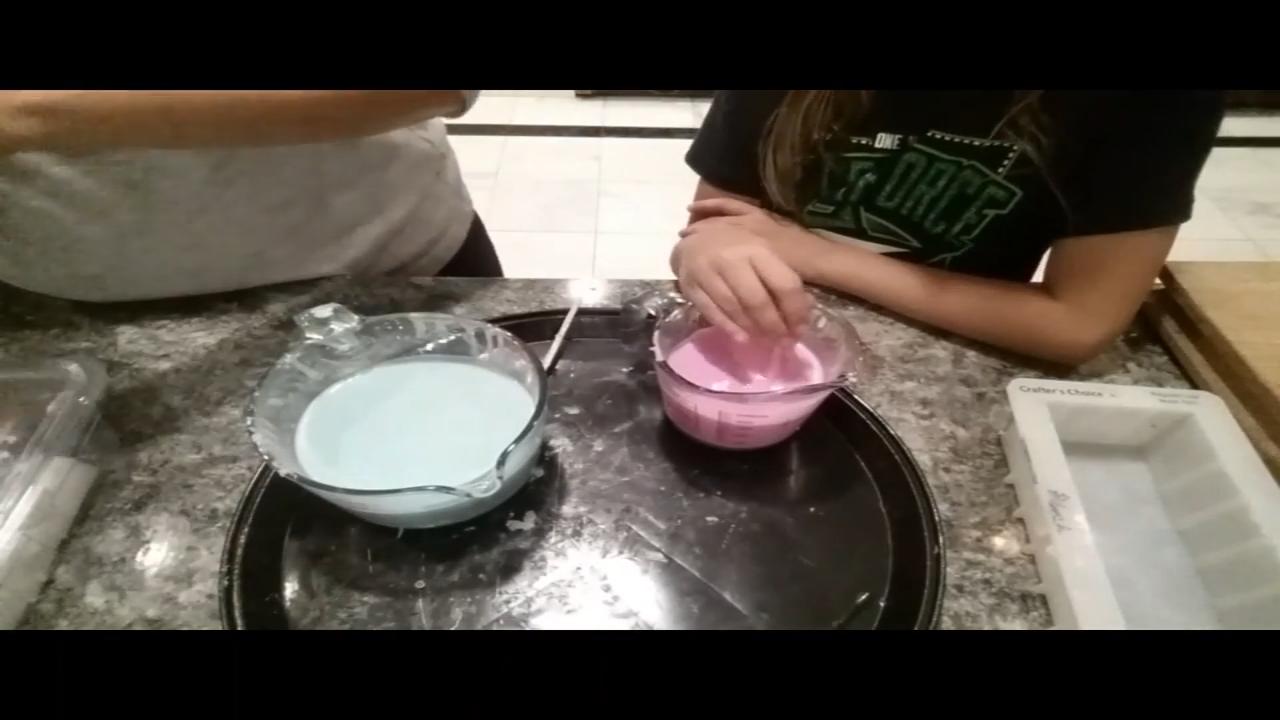 Stirring the pink and green soap to cool