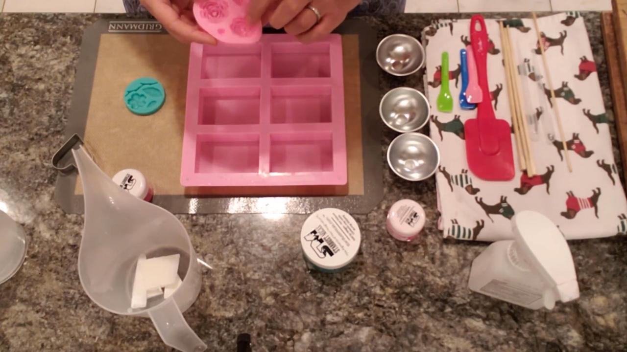 Heart cookie cutters next to a pink bar soap mold