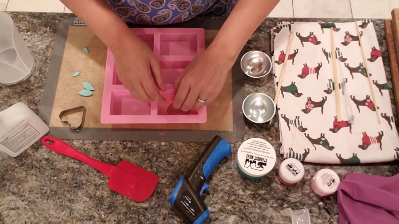 Pouring clear soap around the rose in the heart window