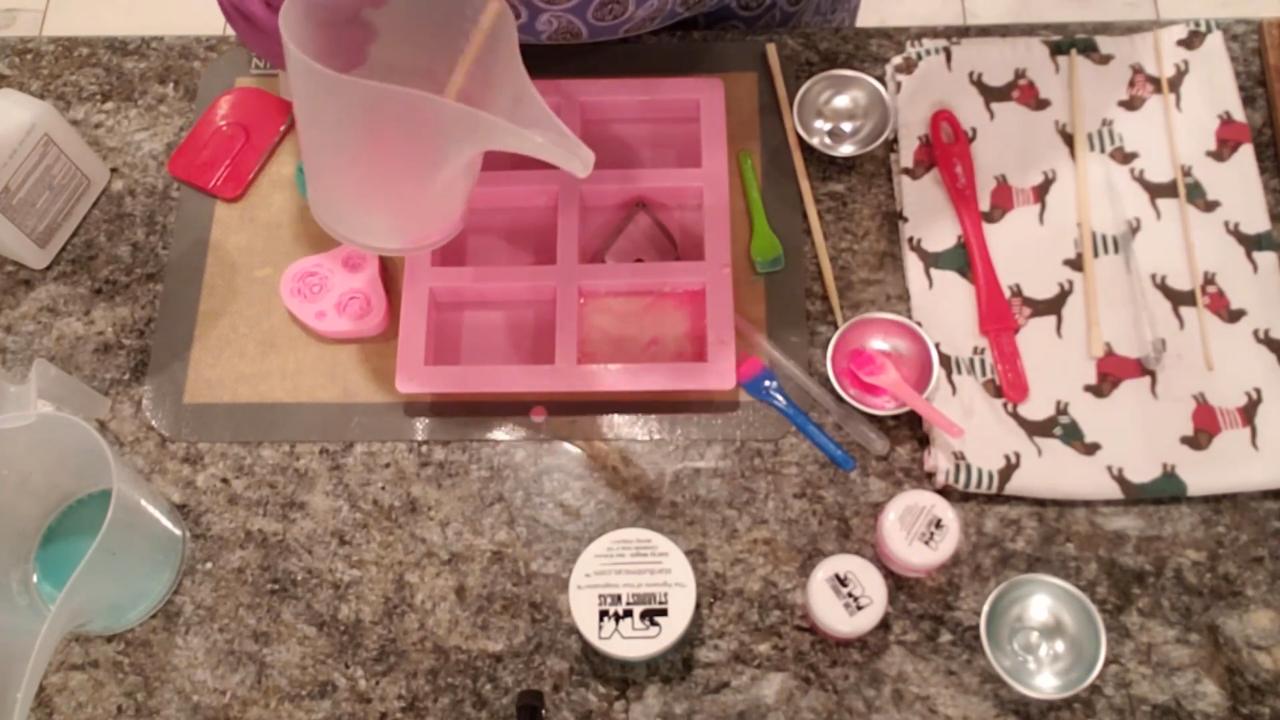 Pouring pink soap into a rose mold