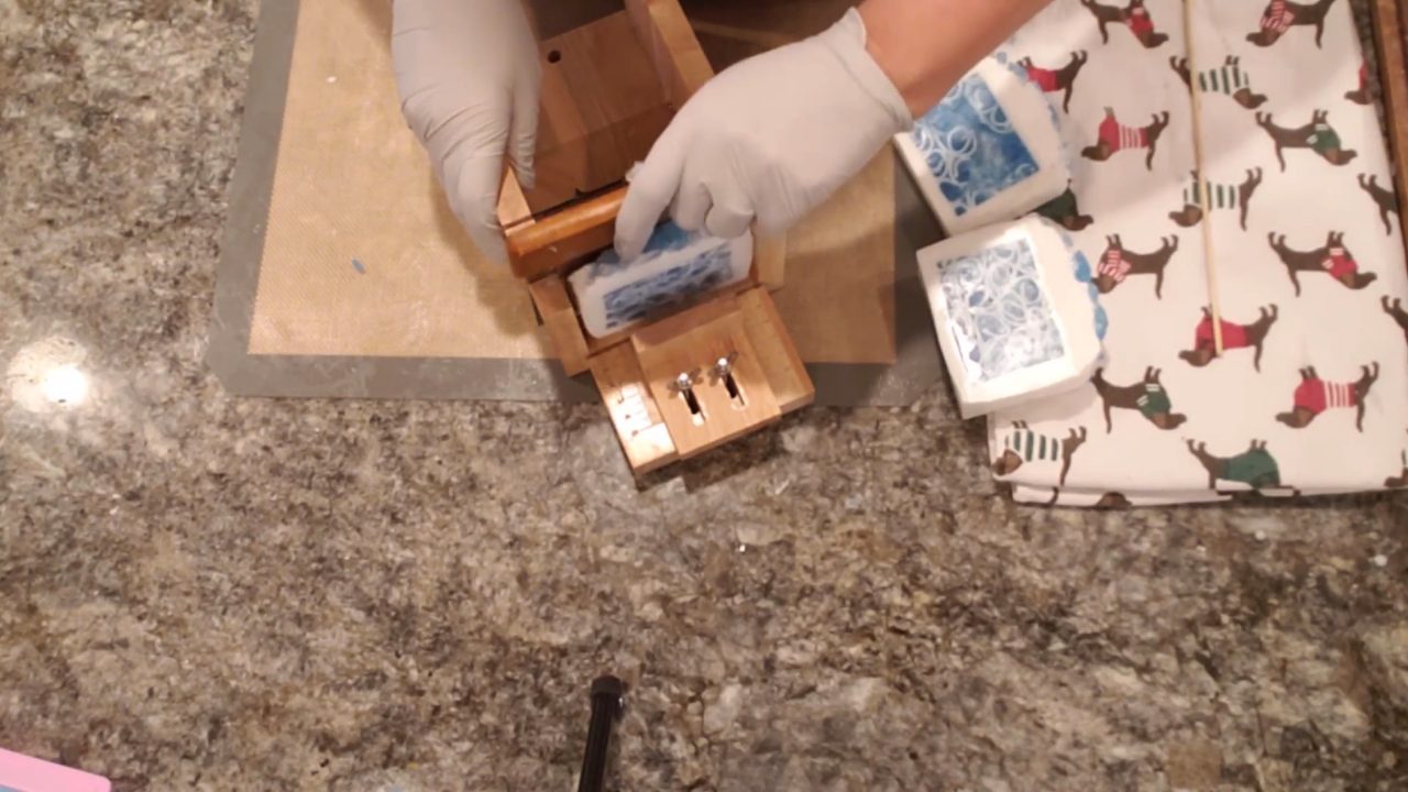 Cut wave embed melt and pour soap bar with blue soap curls inside