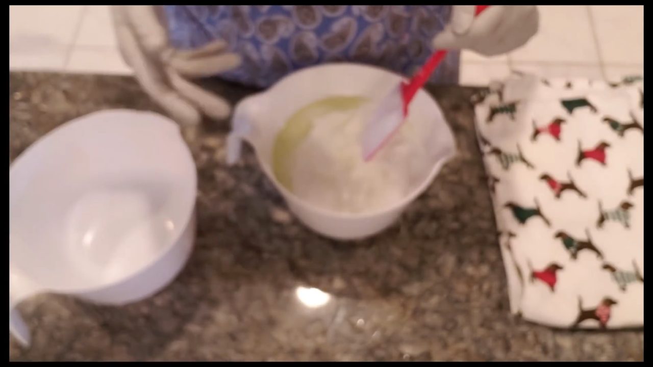 Mixing fragrance oil and vanilla stabilizer into whipped soap base