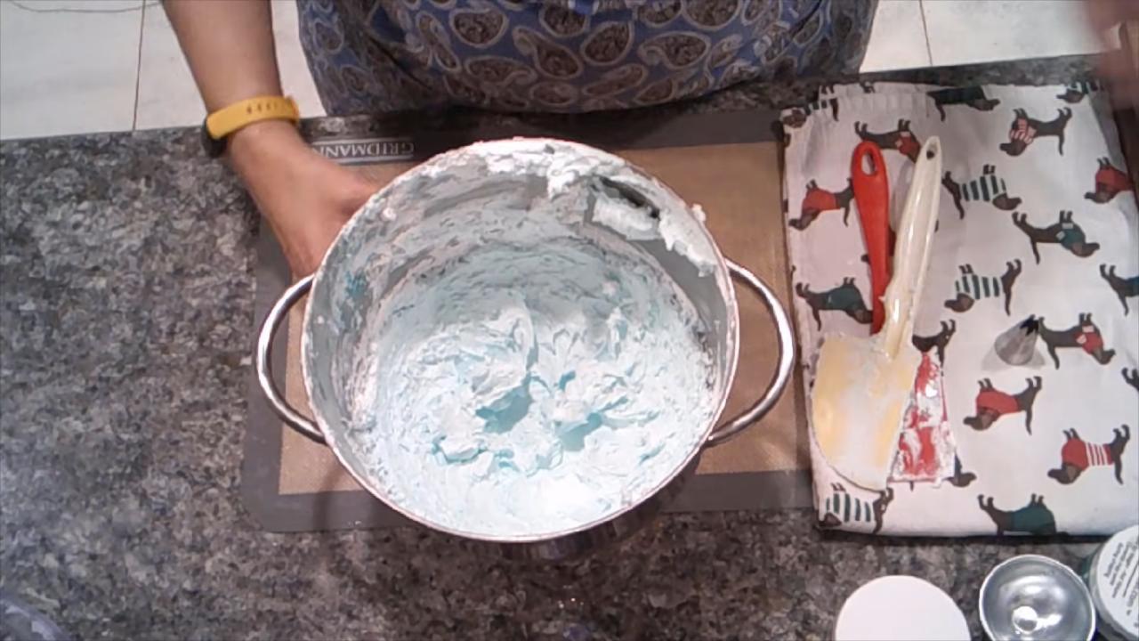 Light green whipped soap in the mixing bowl